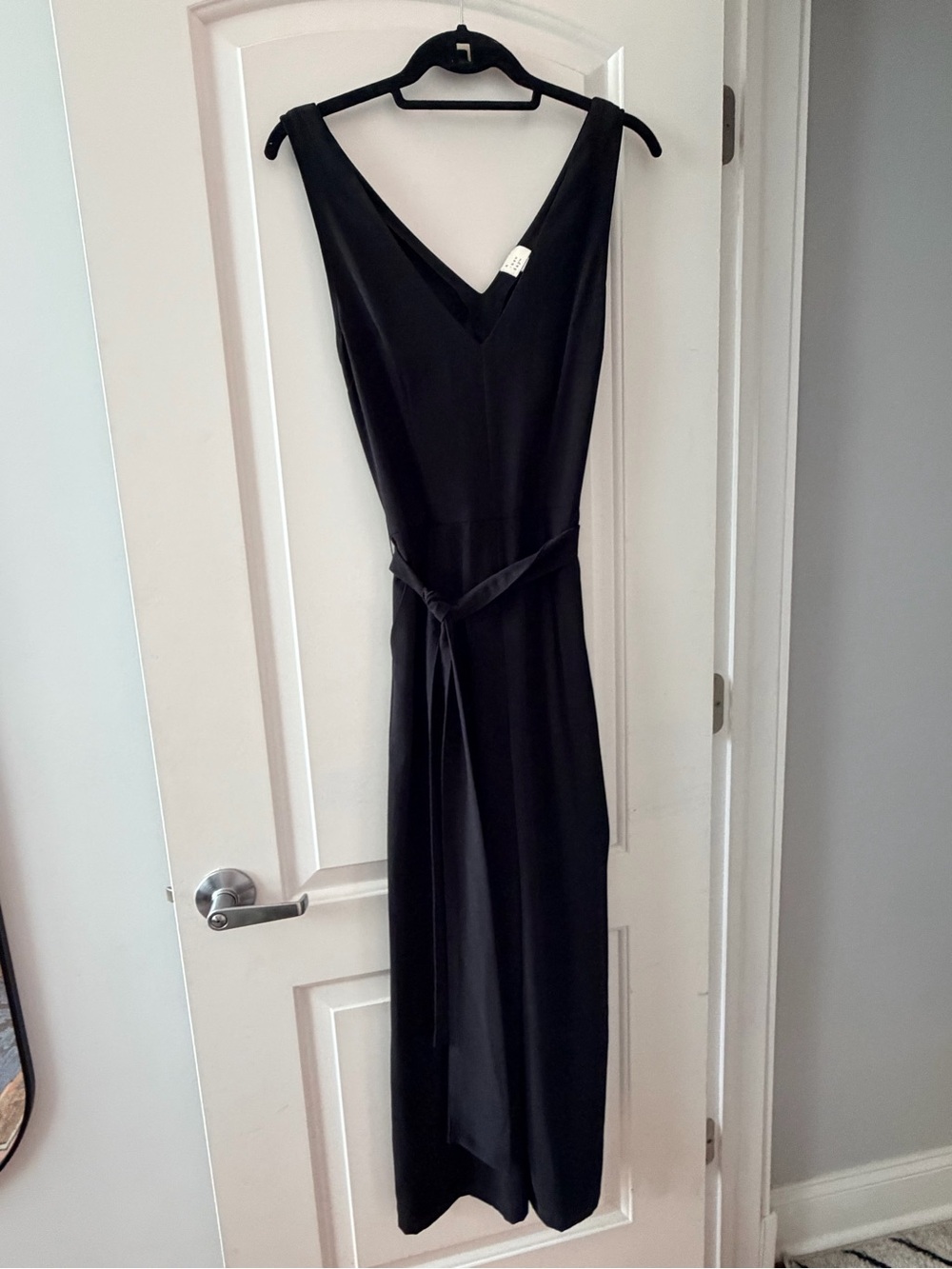 A new day Black V‑Neck Jumpsuit with Self-Tie Waist. Size XS.
